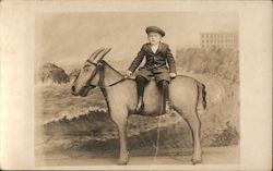 A Young Boy Posing on a Fake Donkey Postcard