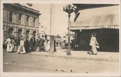 A Large Group of People Walking Down the Street Postcard