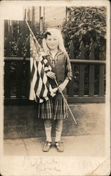 A Young Girl Holding an American Flag Postcard