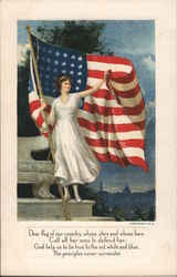 Woman in white dress standing in front of the American flag and holding it Postcard