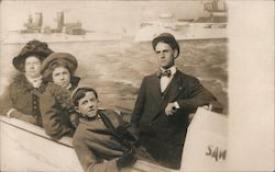 Great White Fleet in the background, with 2 women and 2 men in foreground Postcard