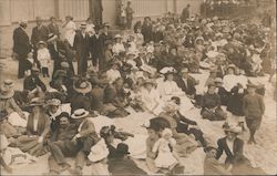 A Large Crowd Sitting on the Ground Postcard