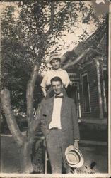 Happy Couple With Straw Hats Pose By Tree Postcard