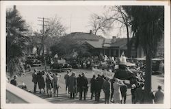 A Parade of Cars and People Lining the Streets Postcard