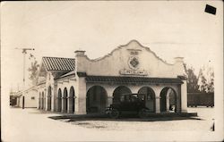 A Building with a Car Parked in Front Petaluma, CA Postcard Postcard Postcard