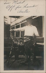 Hunter posing with bird and gun on porch Postcard