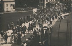 A Large Crowd Walking Down a Sidewalk World War I Postcard Postcard Postcard