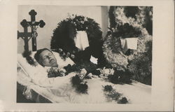 A Person Laying in a Coffin at a Viewing Postcard