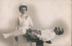 A Nurse Standing Next to a Man who is Lying Down Doctors & Medicine Frank Worden Postcard Postcard Postcard