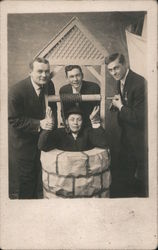 Three Men Standing By a Well With Another Man Inside the Well Postcard