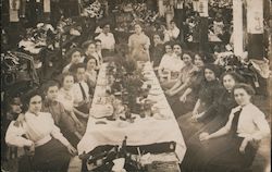 Women Work - A Group of Women Sitting Around a Long Table, Factory? Postcard