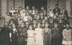 Children Lined Up In Front of a Schoolhouse Postcard