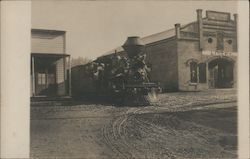 A Train Going Between Two Buildings Guerneville, CA Postcard Postcard Postcard