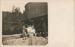 Four People Standing in front of a Water Tank Guerneville, CA Postcard Postcard Postcard