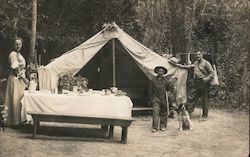 A Man, Woman, Son and Dog at a Camp Site Postcard