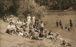 A Group of People on the Bank of a River and in the River Postcard