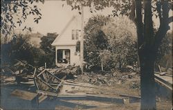 Flood debris in front of a house 1907 Postcard