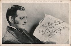 Clark Gable, born in Cadiz, Ohio, Feb. 1st, 1901 reads his home town paper Postcard