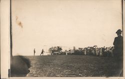 Plane getting ready to take off in front of a crowd Postcard