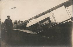 Man Stands next to Crashed Biplane Postcard