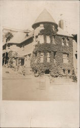 Ivy Covered three story house with Turret Postcard