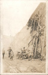 Indian Motorcycles parked under open bridge Postcard