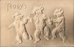 Teddy's. Three bears dancing in the woods. One has a pipe. Bears are raised on postcard. Postcard