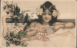 Girl in sundress reclining holding daisy with ocean behind her. Serie 124 Postcard