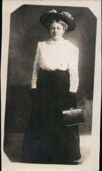 Full portrait of woman with fancy purse and large hat Postcard