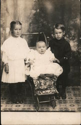 Girl, Baby in Stroller, and Boy Postcard