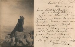 Woman standing on "Lover's Point" Postcard