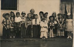 Class photo of children dressed as cowboys, movie stars, pirates Postcard