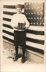 Patriotic: Boy with books standing next to U.S. Flag Postcard Postcard Postcard