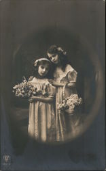 Two young girls with baskets of flowers Postcard