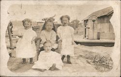 Photo of four young children Postcard