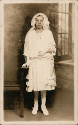 Religious portrait of young girl in veil dressed in white Postcard