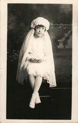 Girl in white dress, shoes, hat, and veil Postcard