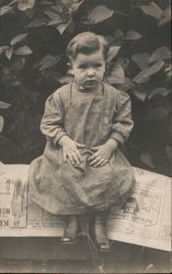 Small Child posing in Dress and Boots Postcard