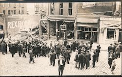 Destruction of building viewed by large crowd Postcard