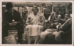 Several people sitting enjoying an ice cream cone Unidentified People Postcard Postcard Postcard