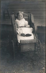 Young child in wicker baby buggy Children Postcard Postcard Postcard