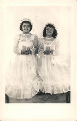 First communion for two young girls dressed in white, rosary and book Children Postcard Postcard Postcard