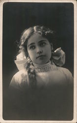 Girl with pearl necklace and braided hair Postcard