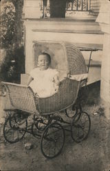 Child in wicker baby carriage Postcard