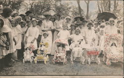 Group of people dressed in white, and girls with flowered doll strollers Dolls Postcard Postcard Postcard