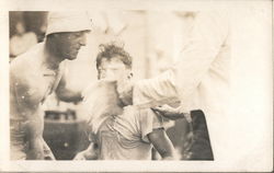 Man getting hit in face with whitewash brush Postcard