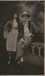 Couple dressed with man in stars and stripes Postcard