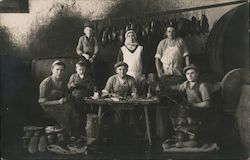 Group of shoemakers, coblers posing at a table with their work Occupational Postcard Postcard Postcard