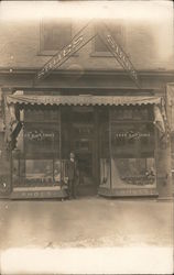 Good Huber Shoes store with man in doorway Postcard