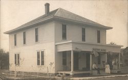 Watson House with couple on front step Postcard